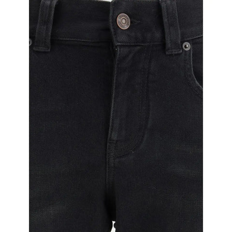 Close-up of Balenciaga Slim bootcut Jeans featuring front zipper and button closure.